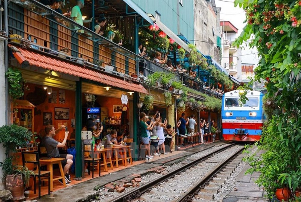 Hanoi's Local Train Rail Cafe: A Glimpse into Everyday Life in Vietnam.